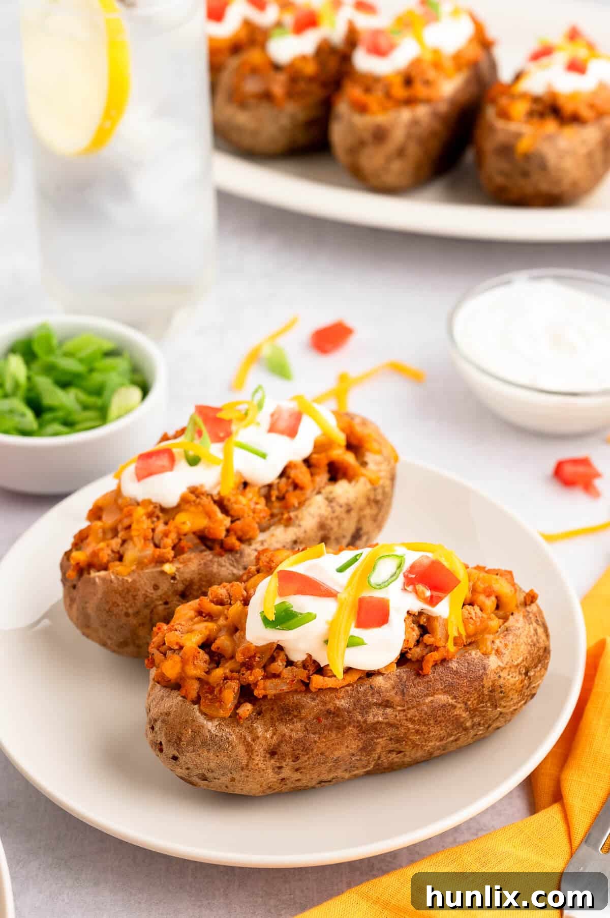 A chicken taco twice-baked potato on a fork, showing the delicious filling.