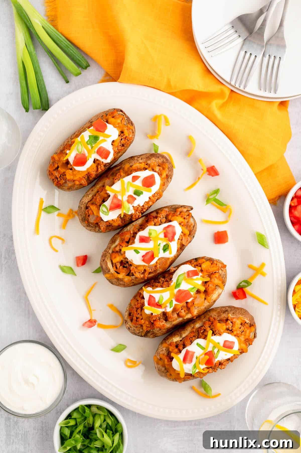 Chicken taco twice-baked potatoes arranged on a large platter.
