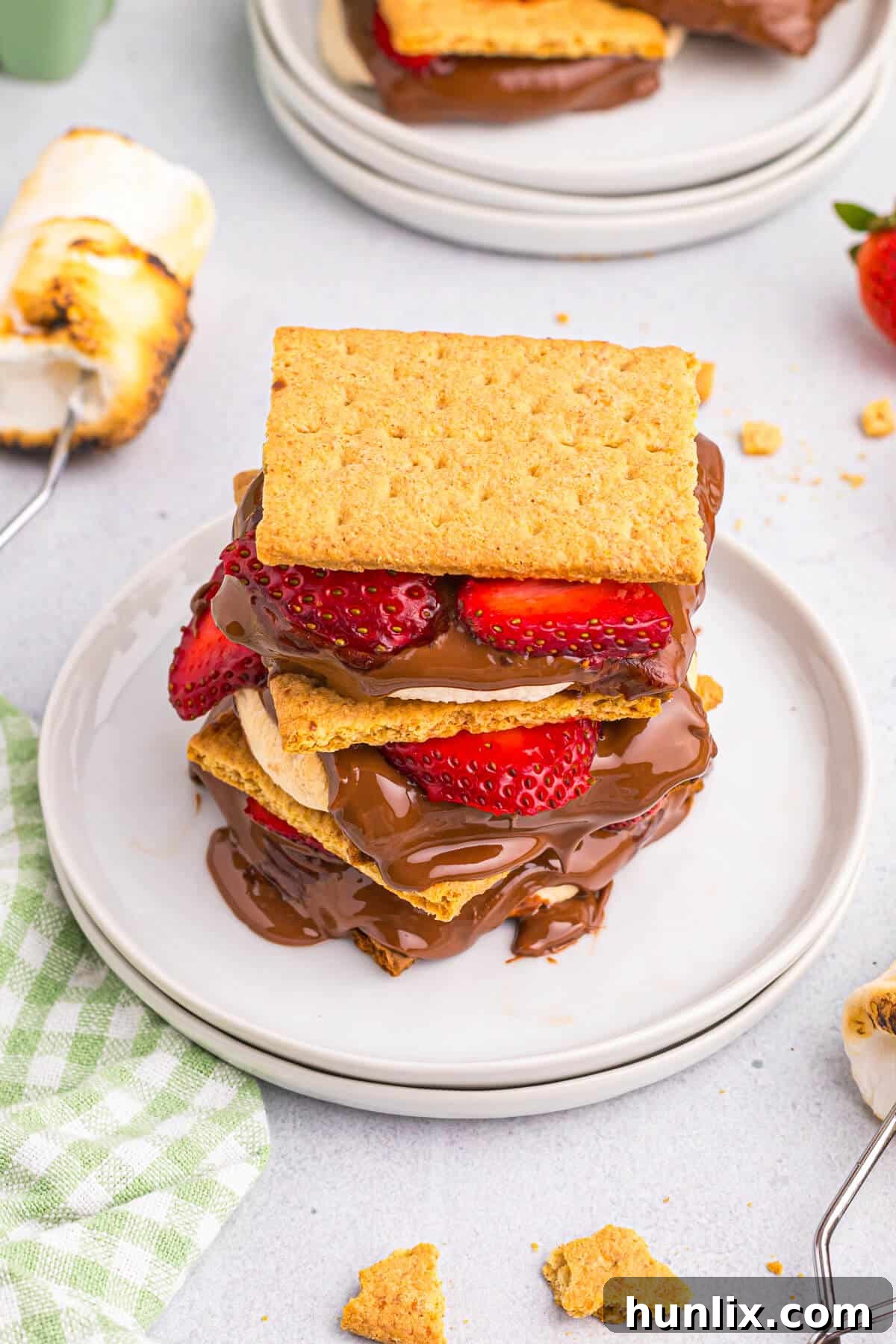 A beautifully plated strawberry s'more, showcasing its delicious layers and fresh fruit.