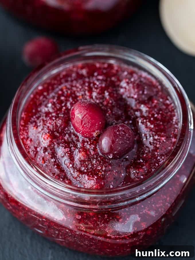 Homemade Cranberry Sugar Scrub - A simple, natural DIY recipe for exfoliating and moisturizing skin using cranberries, sugar, and coconut oil.