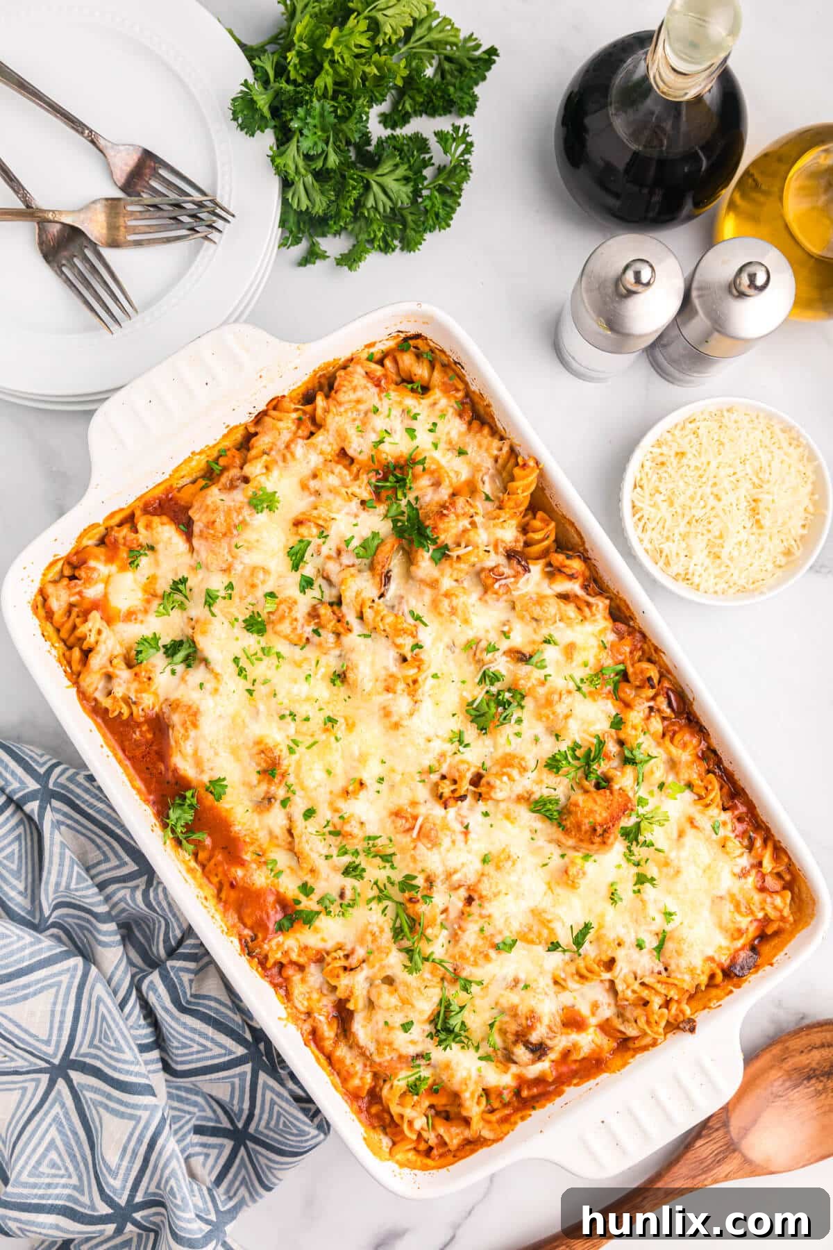 Baked Chicken with Tarragon Pasta 2 Baked chicken and tarragon pasta in a white casserole dish, ready to be served.