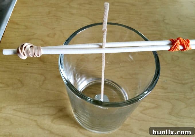 Crafting Layered Jar Candles 3 How to Make a Layered Jar Candle - Ensure your wick is perfectly centered for an even burn.