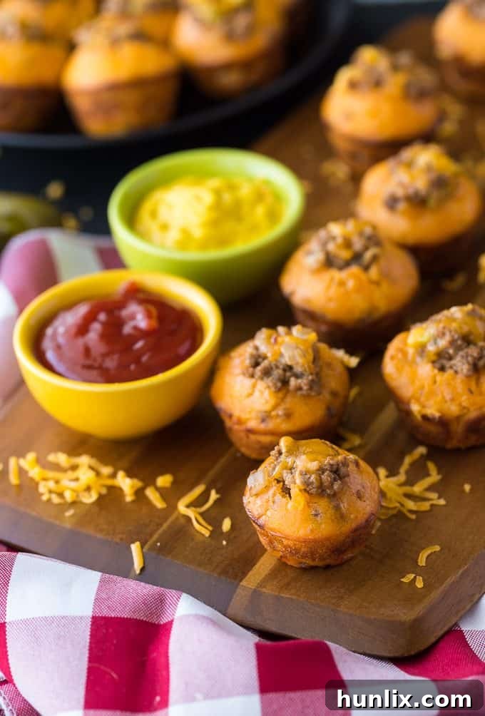 Cheeseburger Bites 9 Close-up view of a single cheeseburger muffin, showcasing its savory filling and fluffy texture.
