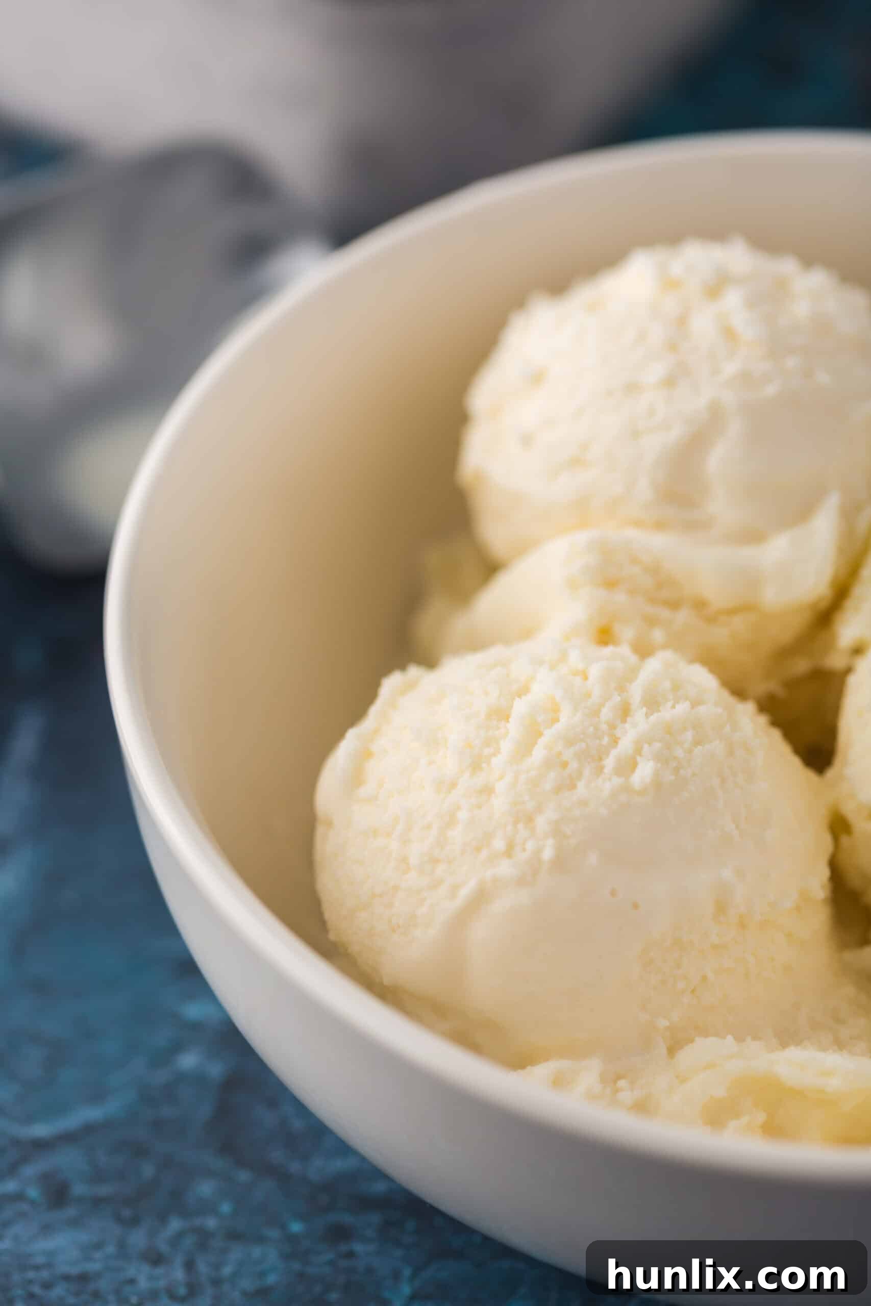 A beautifully textured bowl of homemade vanilla ice cream, showcasing its rich and creamy consistency.