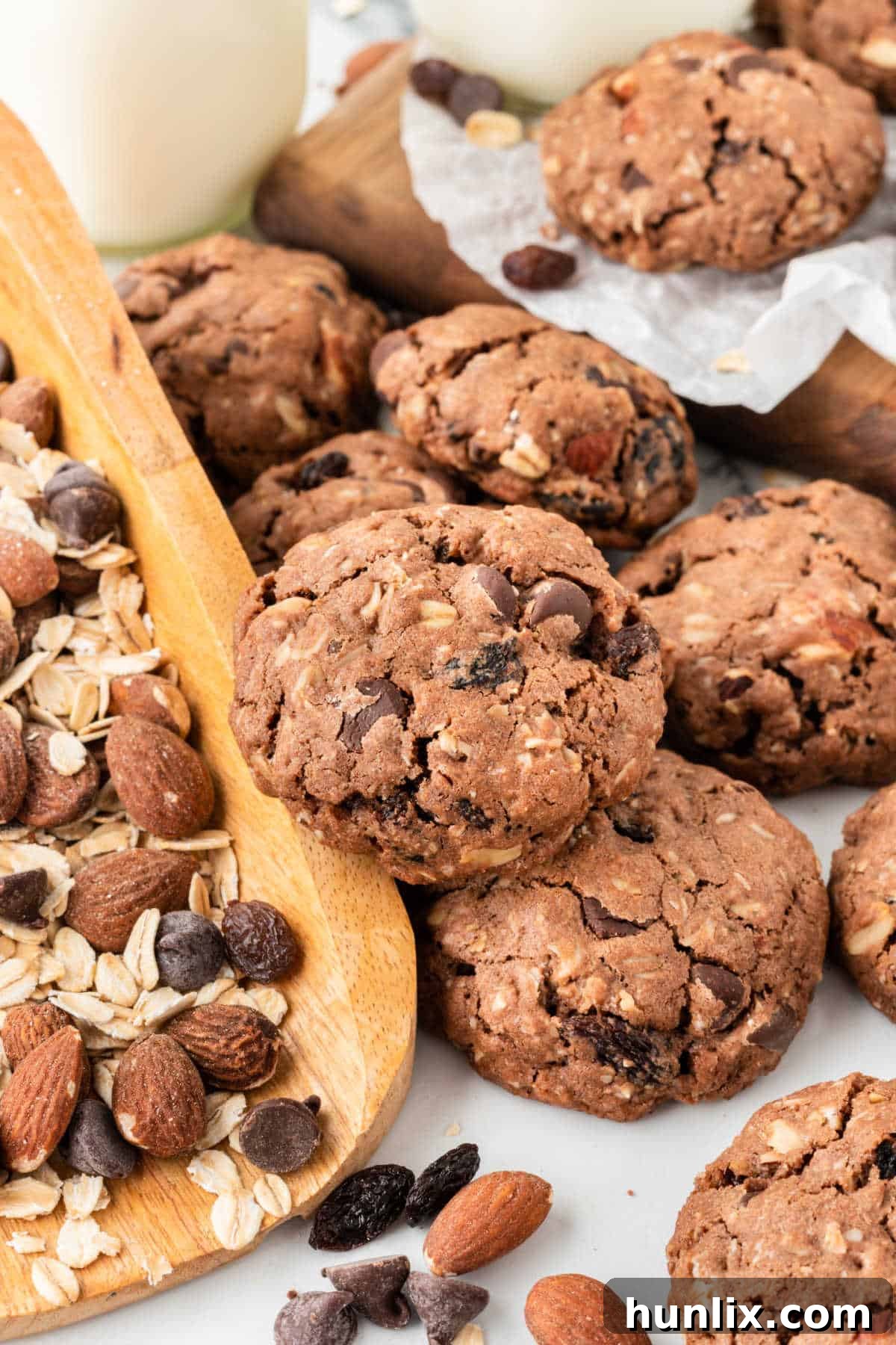 A beautifully arranged group of freshly baked Cowboy Cookies on a rustic wooden surface, highlighting their hearty appearance and delicious mix-ins.