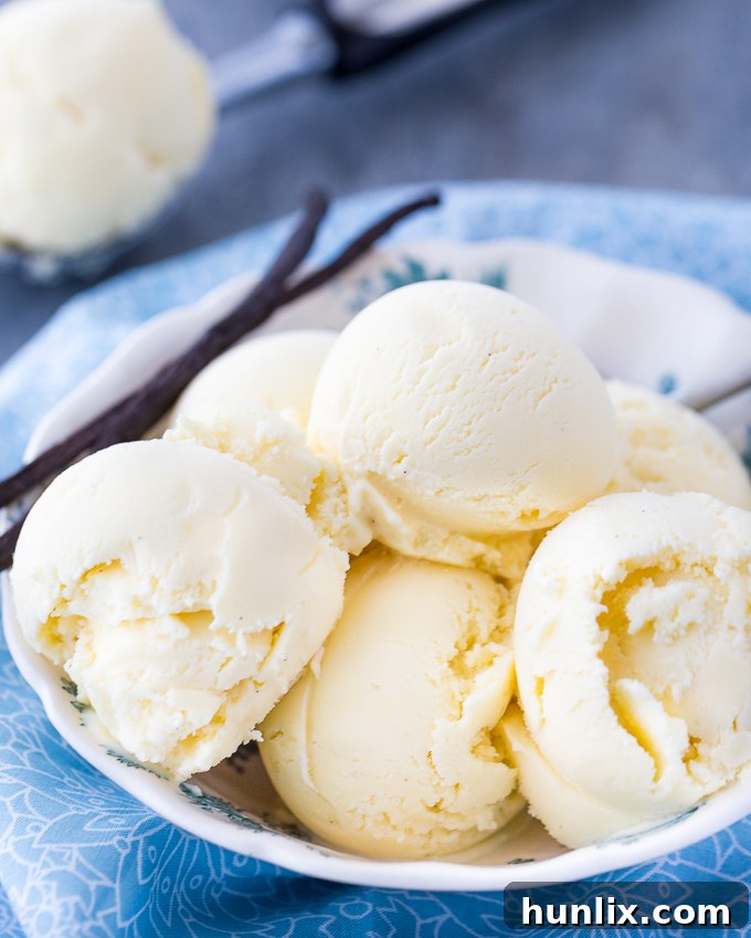 A container of freshly churned Vanilla Bean Ice Cream, ready to be frozen.