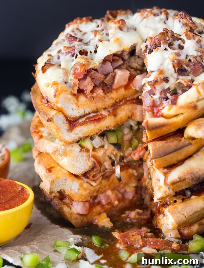 The Ultimate Pizza Stack 11 Pizza Cake - A pizza lover's dream! Every layer is a different flavor for when you can't decide between Meat Lovers and Canadian.