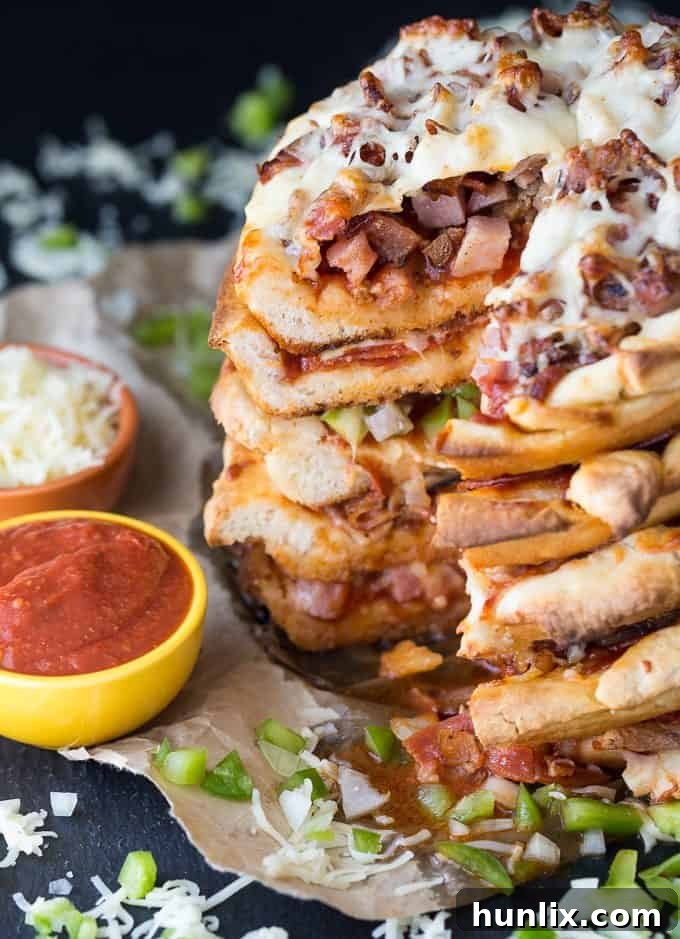The Ultimate Pizza Stack 12 Pizza Cake - A pizza lover's dream! Every layer is a different flavor for when you can't decide between Meat Lovers and Canadian.