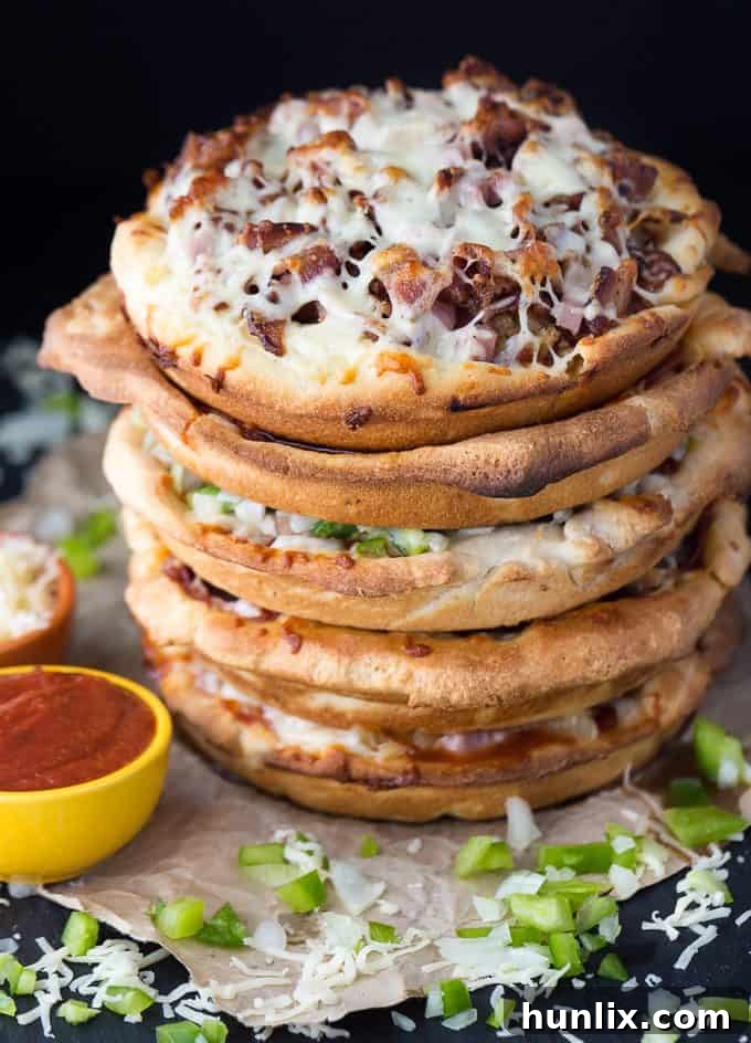 The Ultimate Pizza Stack 9 Pizza Cake - A pizza lover's dream! Every layer is a different flavor for when you can't decide between Meat Lovers and Canadian.