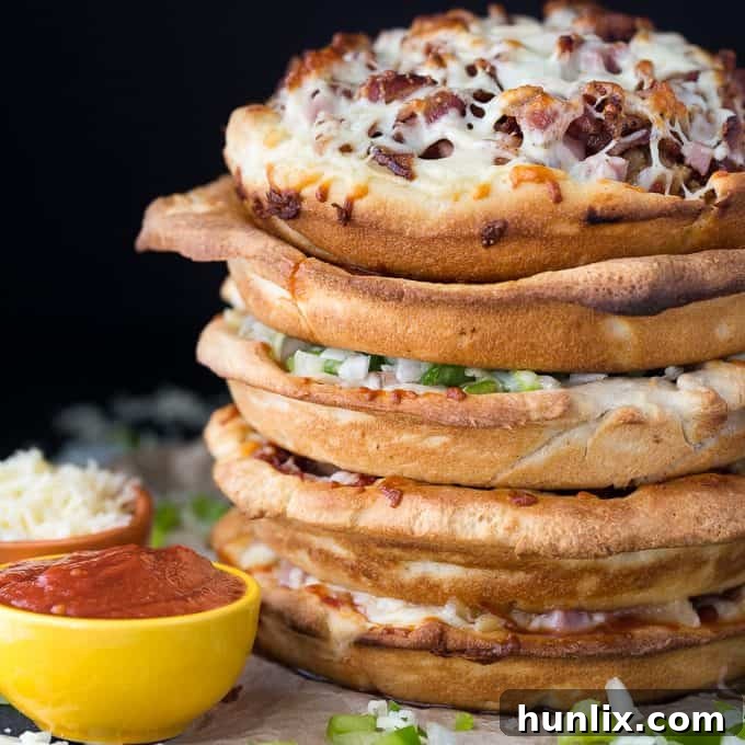 The Ultimate Pizza Stack 10 Pizza Cake - A pizza lover's dream! Every layer is a different flavor for when you can't decide between Meat Lovers and Canadian.