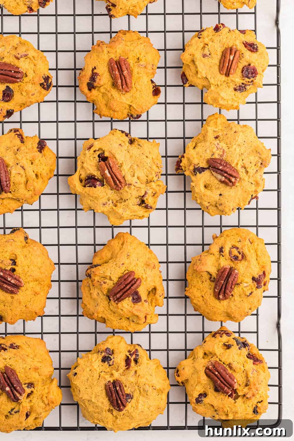 Soft and chewy pumpkin breakfast cookies cooling on a wire rack, ready to be enjoyed with a cup of coffee or tea.