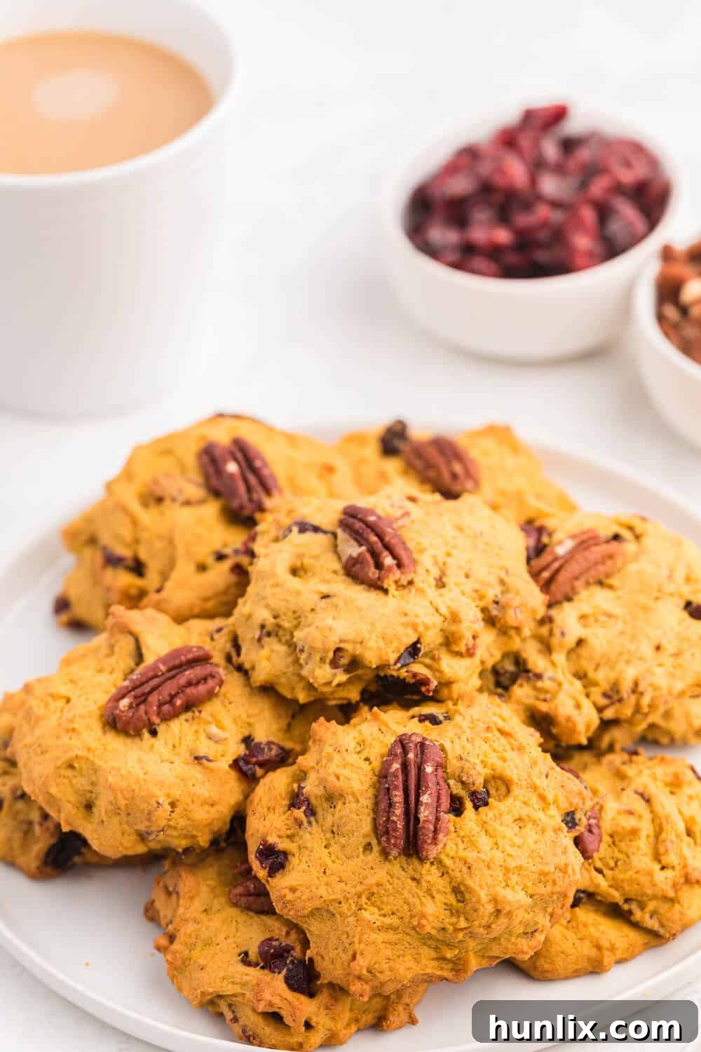 A beautifully presented plate of pumpkin breakfast cookies, highlighting their appealing texture and color.