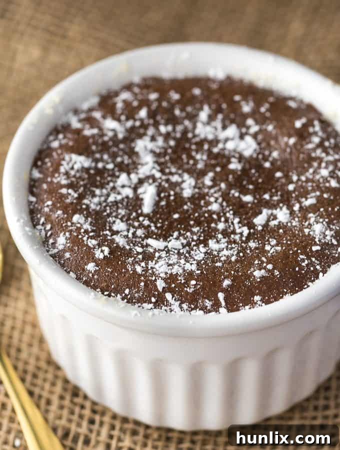 Reese Lava Cake - Decadent dessert alert! This sinfully rich chocolate cake is filled with gooey peanut butter goodness.