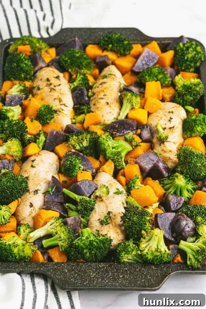 Flavorful One-Pan Maple Dijon Chicken with roasted butternut squash, purple potatoes, and broccoli, perfect for a healthy weeknight dinner.