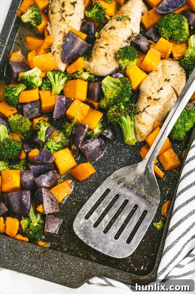 Juicy roasted chicken with the sweet and savory maple Dijon glaze, surrounded by healthy vegetables.