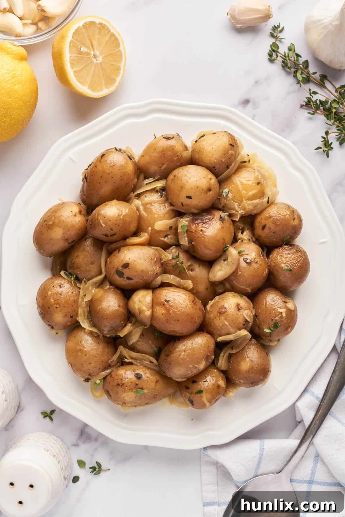 Garlic-Infused Slow Cooker Potatoes 6 A beautifully plated serving of slow cooker garlic potatoes, garnished and ready to enjoy.