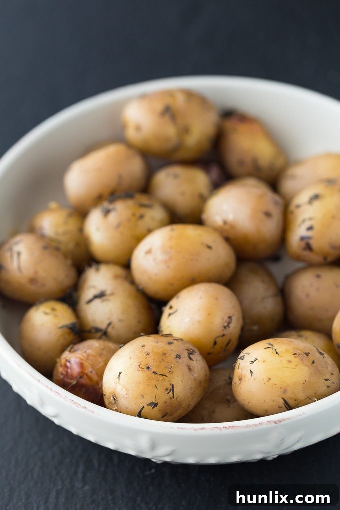 Comforting Slow Cooker Potatoes 2 Close-up of tender savory slow cooker potatoes in a crockpot, seasoned with Summer Savory and garlic.