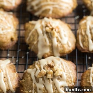 Caramel Apple Cookies - The perfect blend of cinnamon, apples and sweet caramel glaze. They practically melt in your mouth.