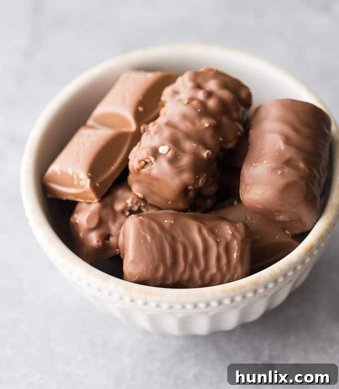 Rich, fudgy and chewy Halloween Brownies loaded with various leftover Halloween chocolates, perfect for using up excess candy.