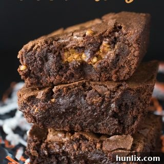 A delicious Halloween brownie with melted candy pieces inside, ready to be served.