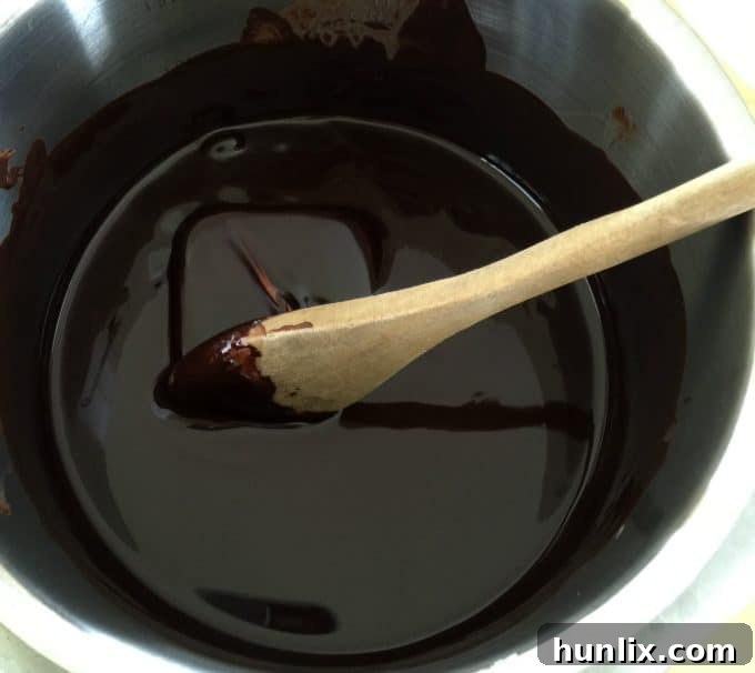 Glossy melted chocolate and butter mixture, stirred constantly to prevent burning, for a rich brownie batter.