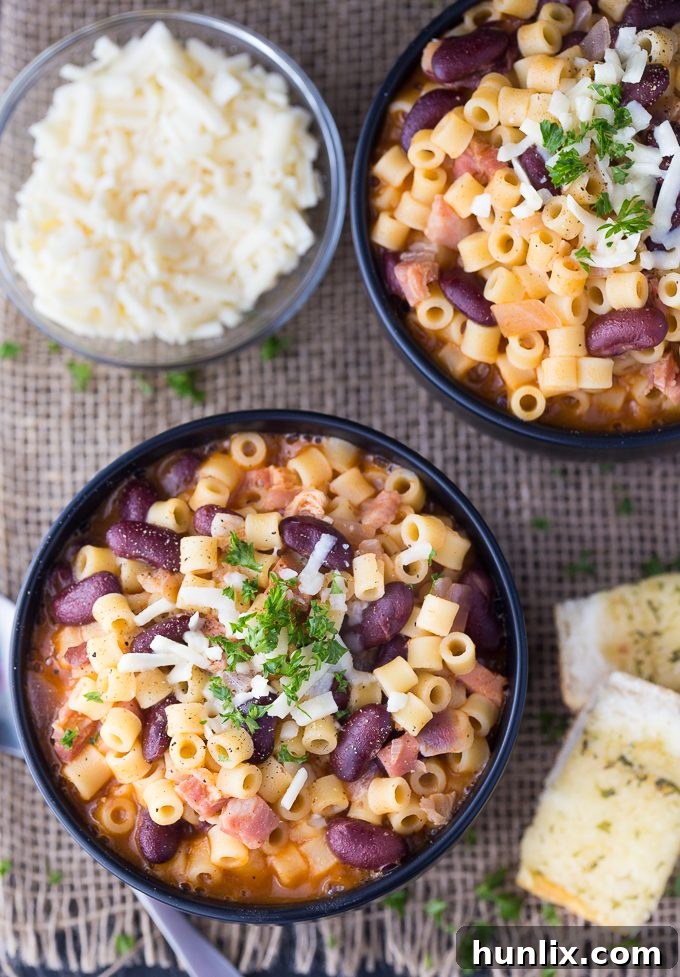 Pasta e Fagioli - This classic Italian noodle soup is so hearty and comforting! Pancetta and kidney beans mixed with fun round noodles and Asiago cheese.