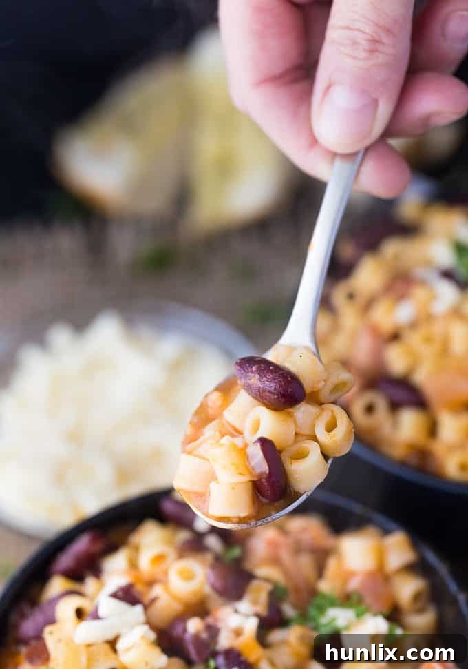 Pasta e Fagioli - This classic Italian noodle soup is so hearty and comforting! Pancetta and kidney beans mixed with fun round noodles and Asiago cheese.