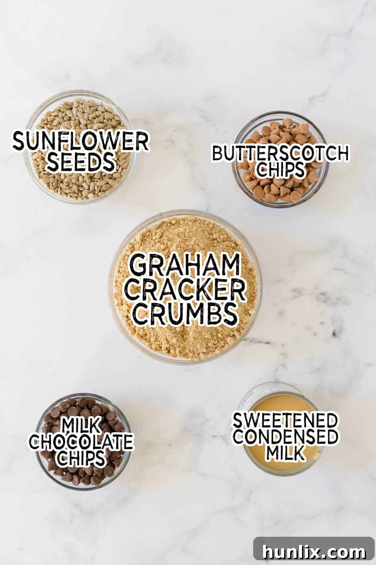 Ingredients for chewy bars laid out on a marble counter.