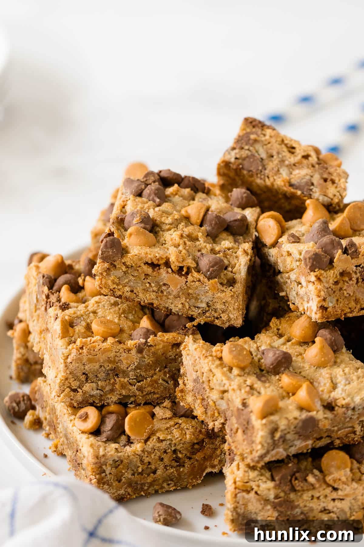 Stacked chewy bars on a plate, ready to be enjoyed.