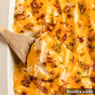 The recipe in a pan with a wooden spoon.