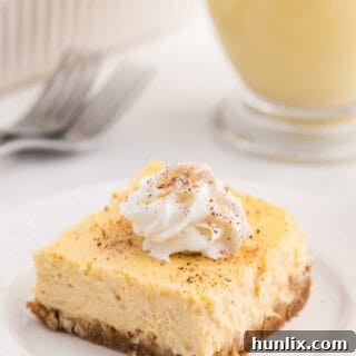 A piece of the recipe topped with whipped cream on a white plate, ready to be enjoyed.