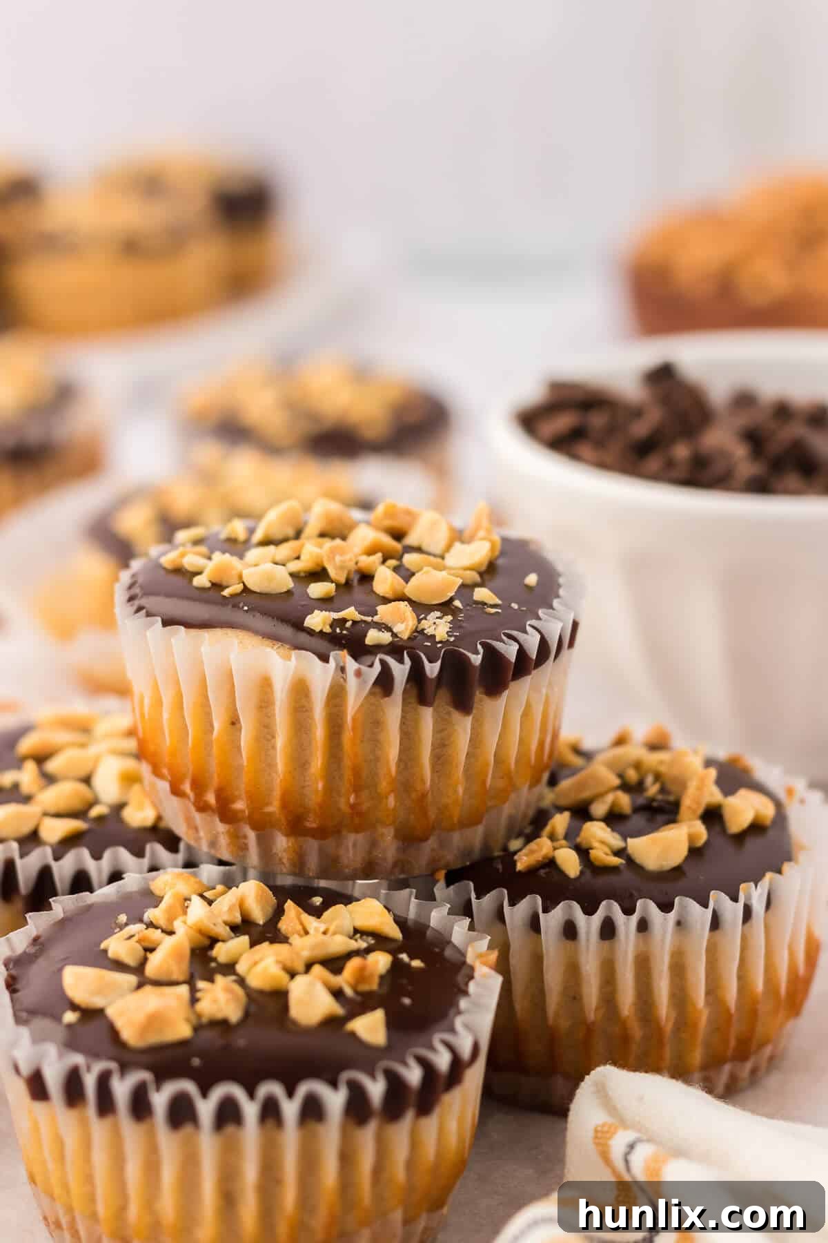 A beautifully presented platter of mini peanut butter cheesecakes, ready to be served at a gathering.