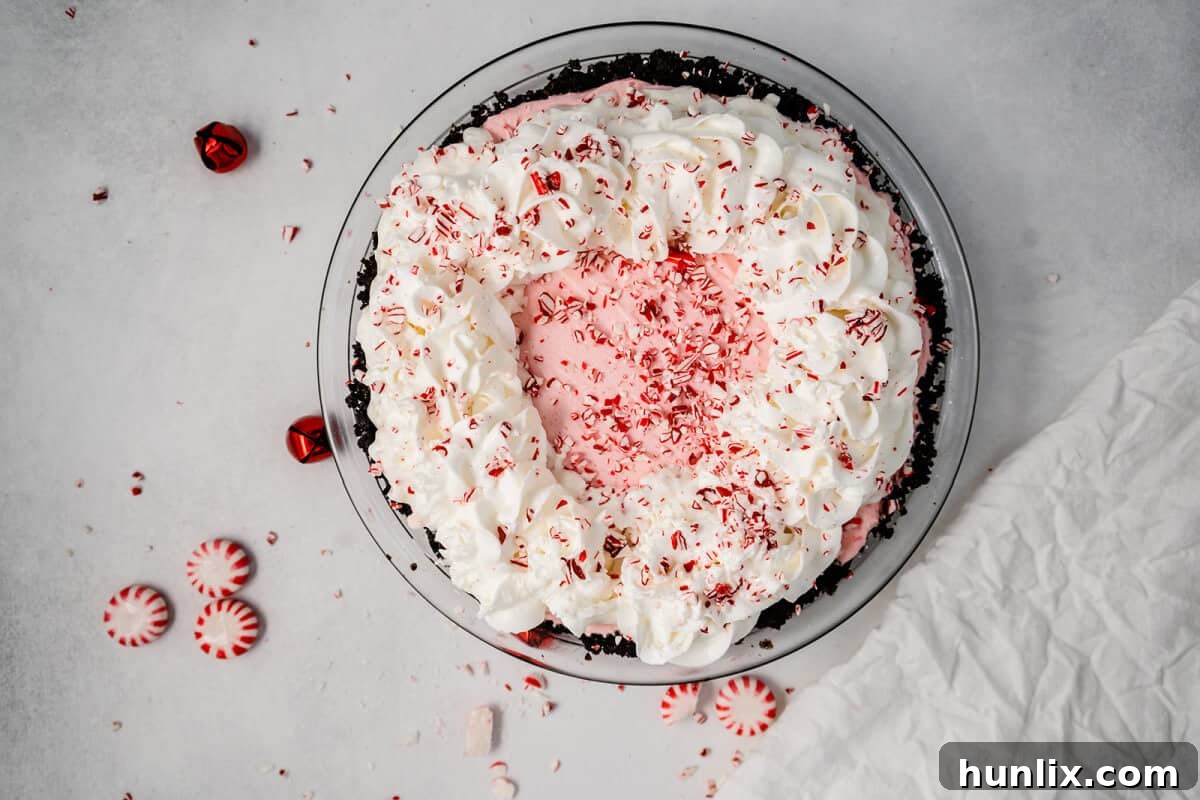 No-Bake Peppermint Pie - This festive dessert combines subtle peppermint flavor with marshmallows, whipped cream, and an Oreo cookie crust for a perfect holiday treat.