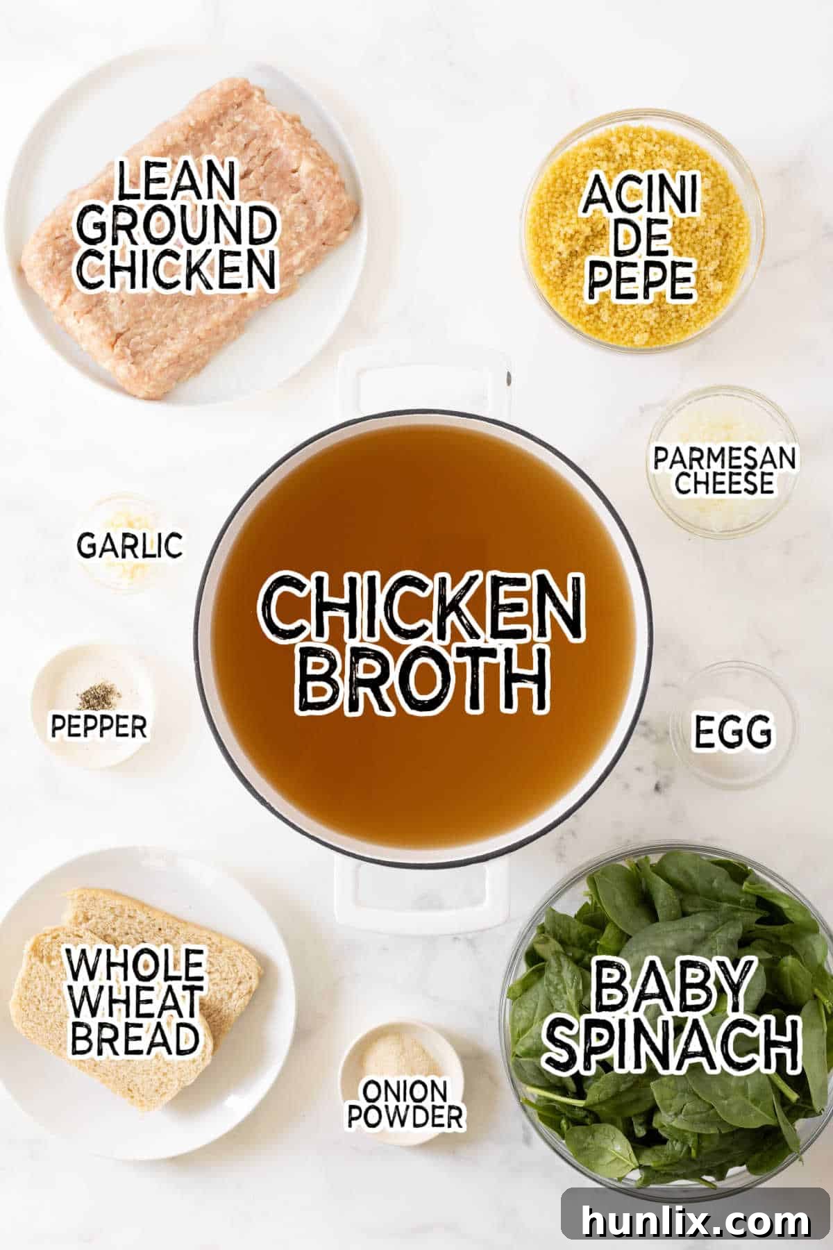 Hearty Italian Wedding Soup with Tender Chicken Meatballs 3 A selection of fresh ingredients laid out, including ground chicken, spinach, and acini de pepe pasta, ready to make Italian wedding soup.
