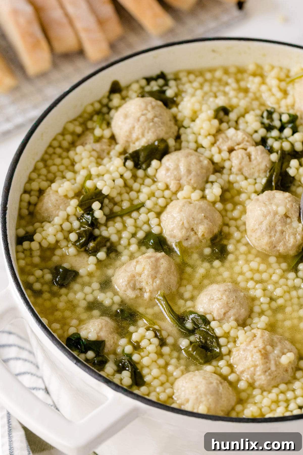 Hearty Italian Wedding Soup with Tender Chicken Meatballs 6 A large pot of Italian Wedding Soup with chicken meatballs, ready to be served.