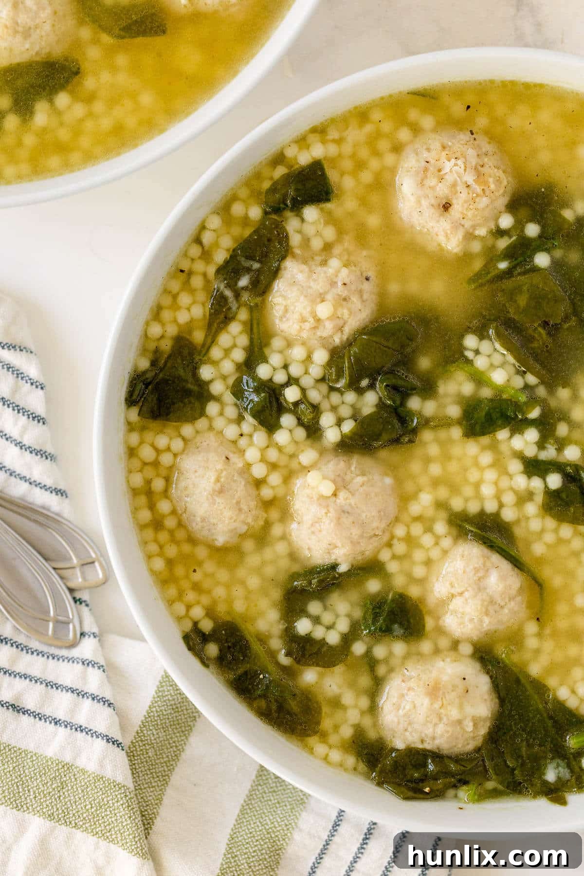 Hearty Italian Wedding Soup with Tender Chicken Meatballs 8 A full bowl of Italian Wedding Soup with chicken meatballs, ready to be enjoyed.