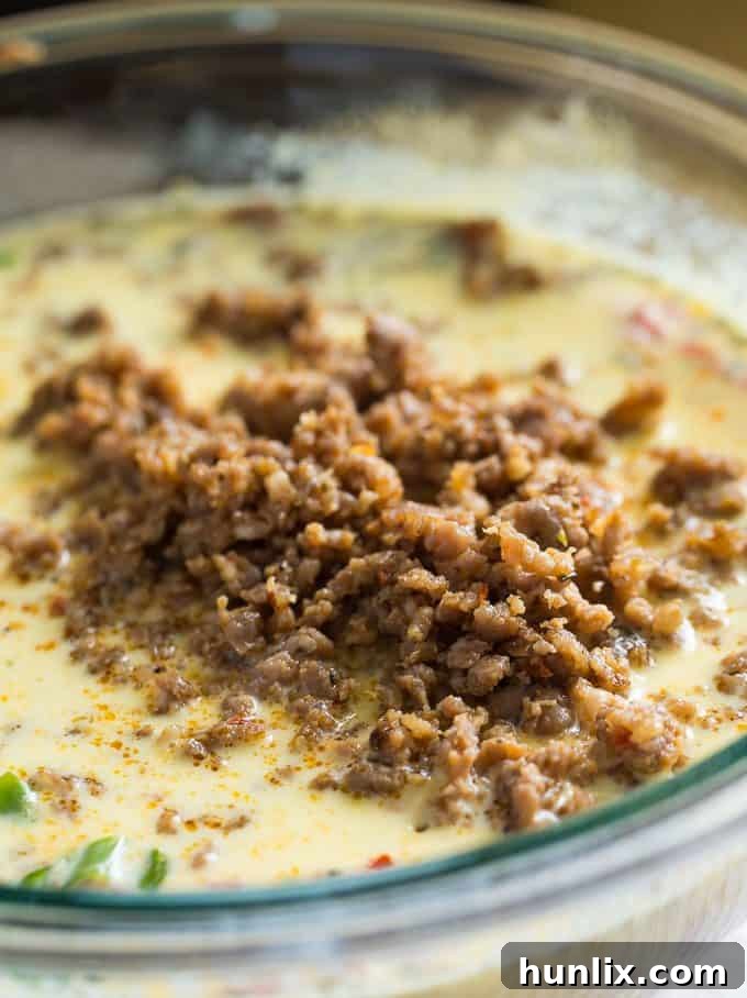 Sausage & Butternut Squash Breakfast Casserole - A delicious, hearty and easy breakfast casserole recipe perfect to serve to your holiday guests!