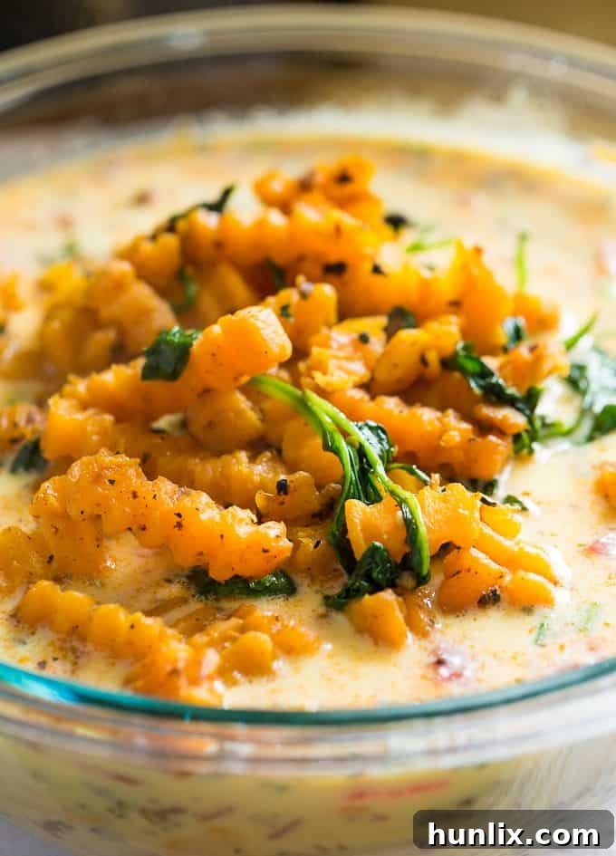 Sausage & Butternut Squash Breakfast Casserole - A delicious, hearty and easy breakfast casserole recipe perfect to serve to your holiday guests!