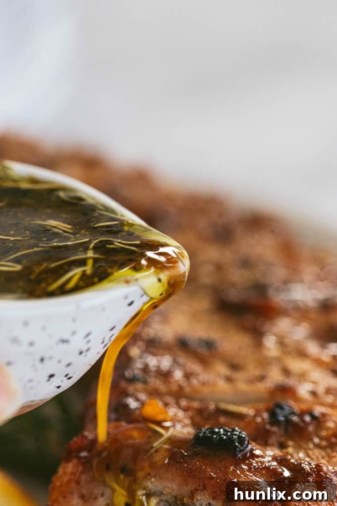 Orange Mustard Pork Tenderloin - This easy glazed tenderloin recipe is sweet and savory with orange juice and stone ground mustard. You'll never have a dry piece of pork with this homemade marinade.