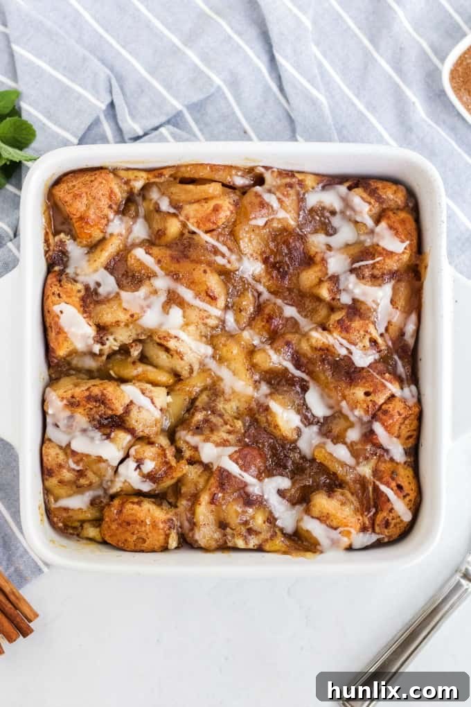 Warm Apple Cinnamon Breakfast Bake 2 A pan of Apple Cinnamon Bun Breakfast Casserole, freshly baked and golden brown.