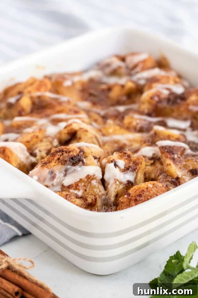 Warm Apple Cinnamon Breakfast Bake 3 A close-up of the Apple Cinnamon Bun Breakfast Casserole in a baking dish.