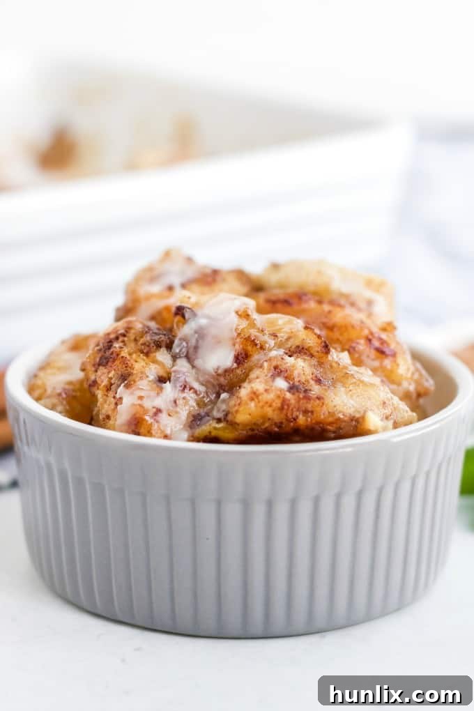 Warm Apple Cinnamon Breakfast Bake 5 A serving of Apple Cinnamon Bun Breakfast Casserole in a small ramekin.