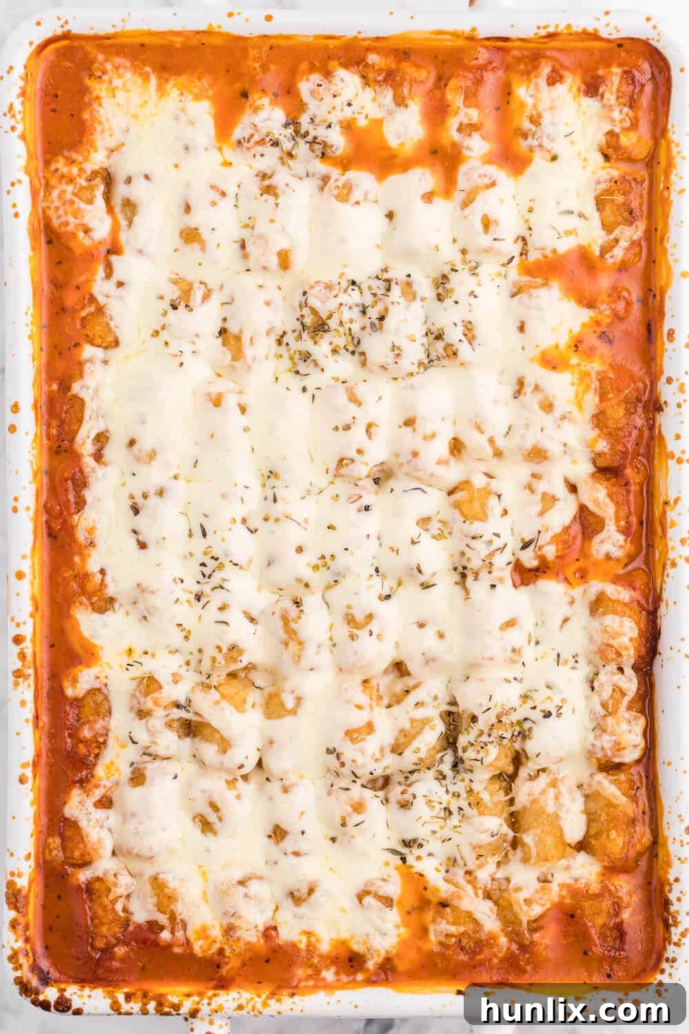 Lasagna Tater Tot Casserole - A kid-friendly family dinner recipe using tater tots to replace traditional noodles for a delicious twist on a classic favorite.