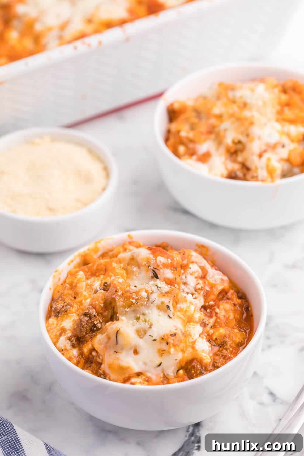 Close-up of baked Lasagna Tater Tot Casserole with melted cheese and crispy tots.