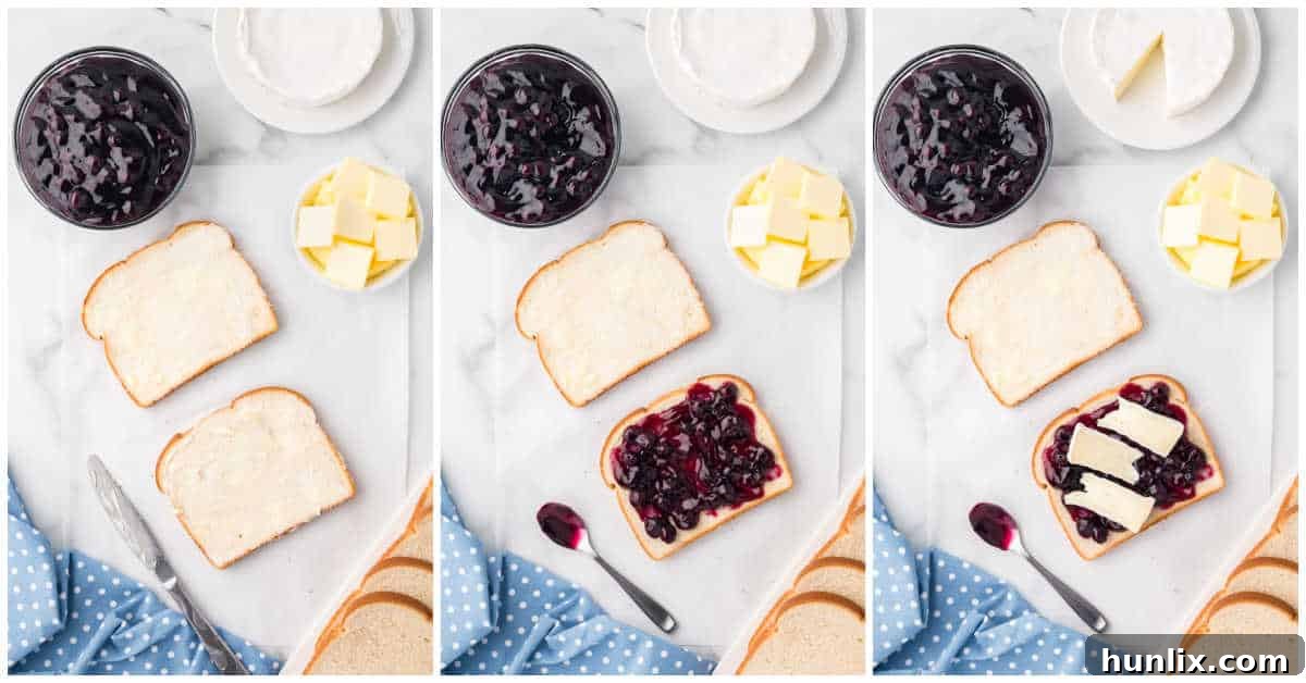 Two slices of bread with butter, brie cheese, and blueberry pie filling ready to be assembled into a grilled cheese.