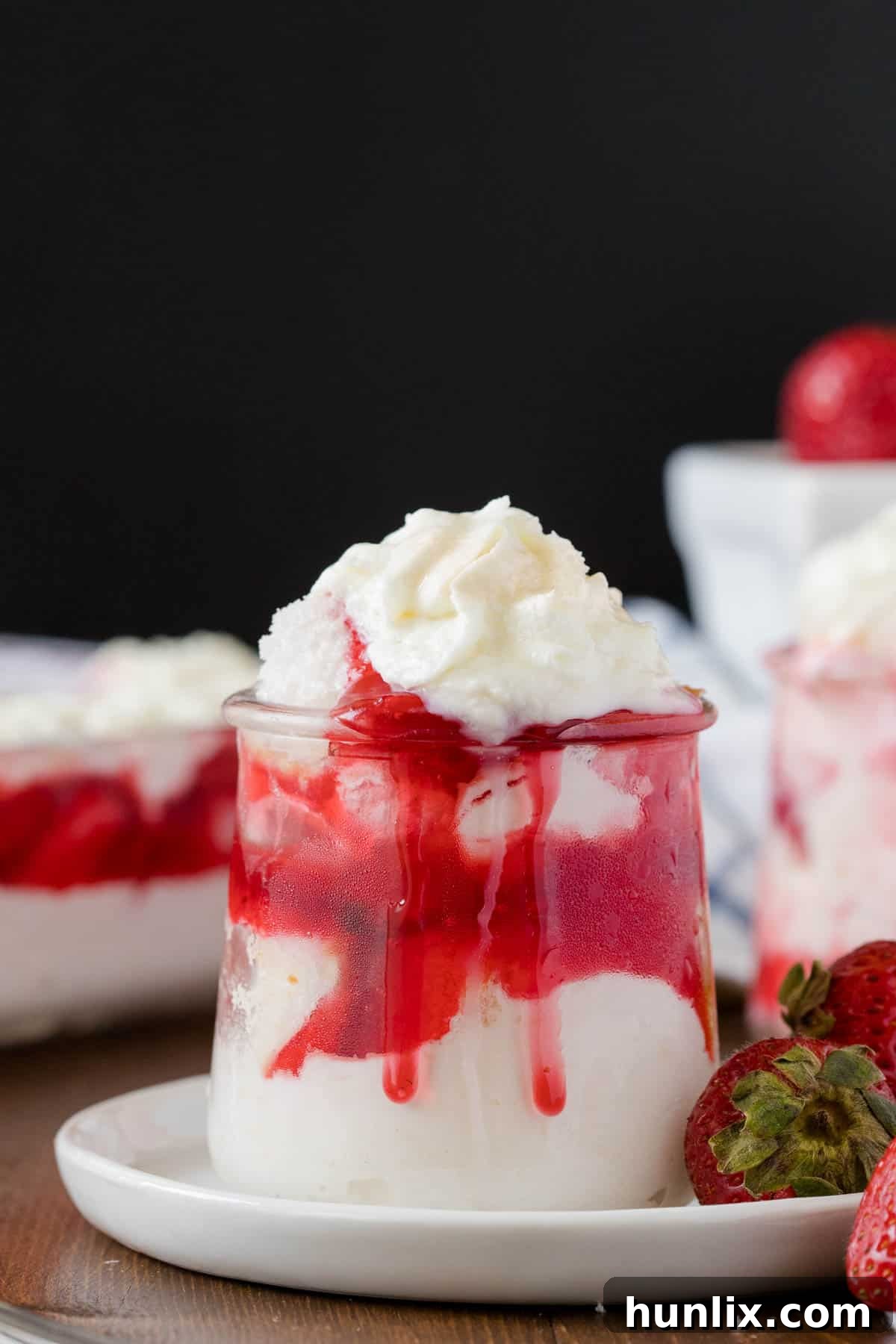 Strawberries in the Snow served in a parfait dish, showing the beautiful layers and fresh strawberries.
