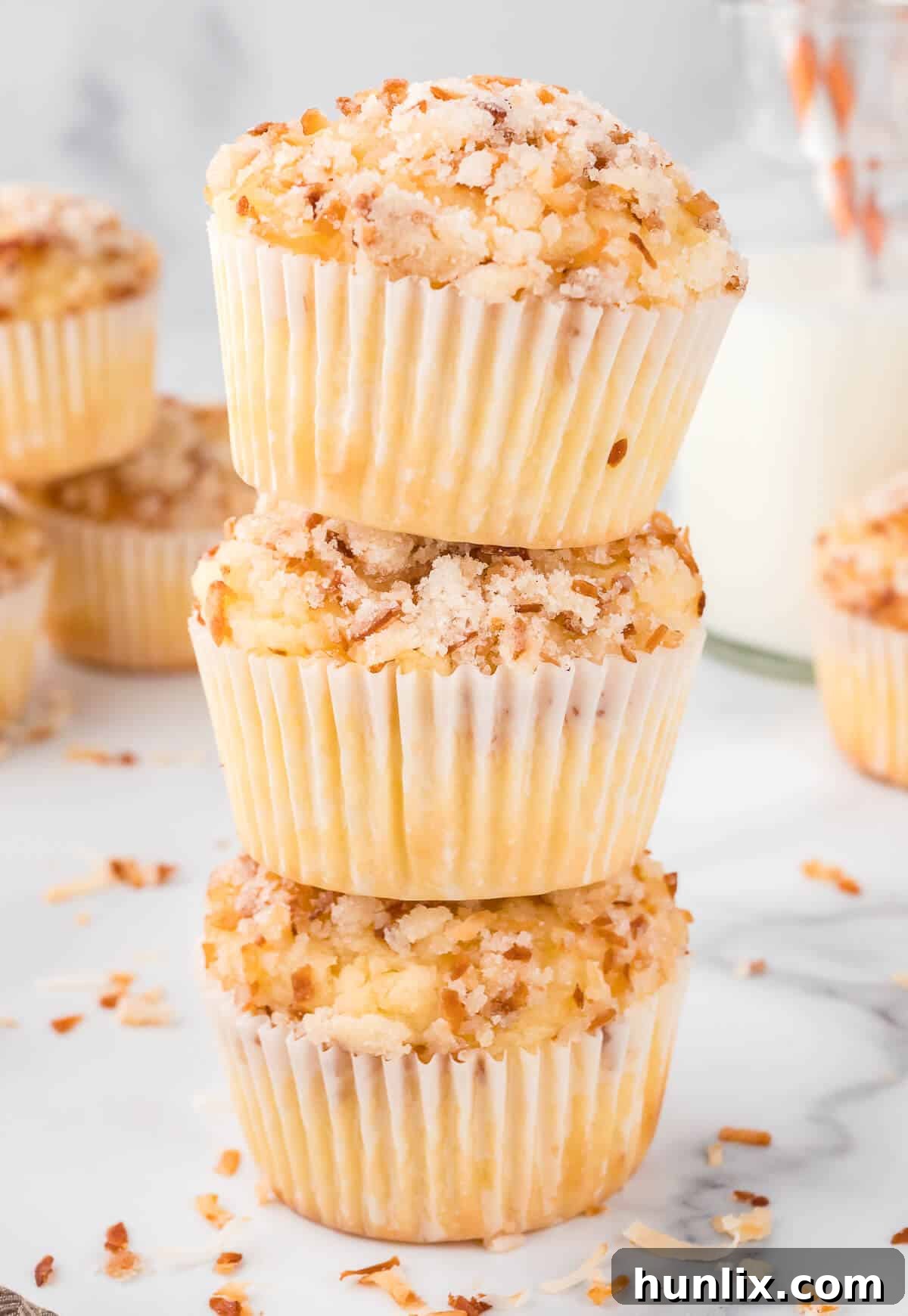 A tempting stack of toasted coconut muffins, ready to be enjoyed.