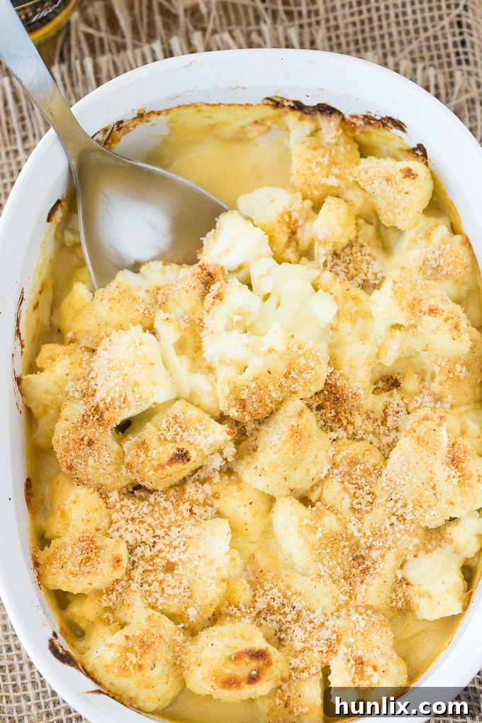 Honey Dijon Baked Cauliflower - This easy side dish is hearty enough for Meatless Monday! This cauliflower casserole recipe is super tangy and covered in breadcrumbs and Parmesan cheese. Yum!