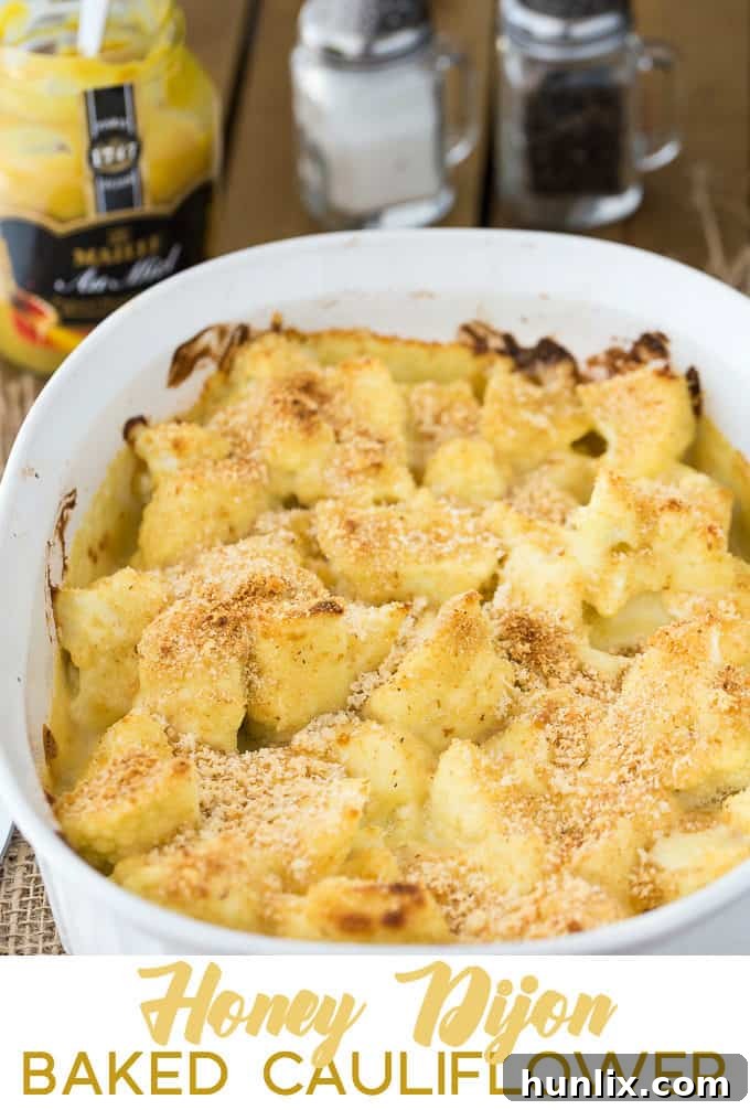 Honey Dijon Baked Cauliflower - This easy side dish is hearty enough for Meatless Monday! This cauliflower casserole recipe is super tangy and covered in breadcrumbs and Parmesan cheese. Yum!