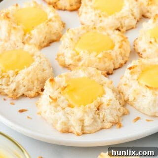 Lemon curd coconut macaroons on a plate, ready to be served or stored.